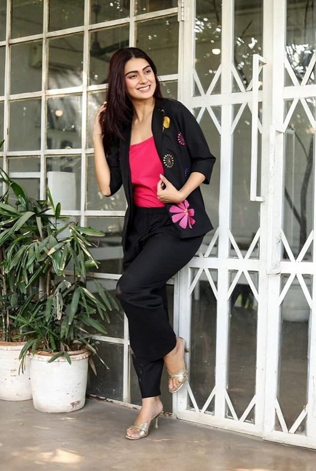 Black Floral Embroidered 3-Piece Co-ord Set-Front view of a woman wearing a tailored black blazer, matching inner top, and trousers with floral embroidery.