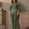 Olive Green Cotton Warli Embroidered Co-ord Set for women - Full-length front view of a girl wearing a set featuring intricate floral warli embroidery on the shirt and a relaxed fit.