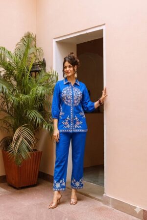 royal blue embroidered shirt collar tunic co-ord set - A full-length shot of a woman modeling the vibrant outfit, featuring a button-down front and perfectly matching trousers.