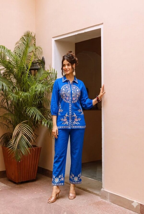 royal blue embroidered shirt collar tunic co-ord set - A full-length shot of a woman modeling the vibrant outfit, featuring a button-down front and perfectly matching trousers.