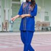 Royal-Blue-Floral-Embroidered-Flex-Cotton-Co-ord-Set-styled-right-profile Royal Blue Floral Embroidered Flex-Cotton Co-ord Set - A profile shot highlighting the trouser fit and the comfort-first design of the waistband, perfect for all-day wear.