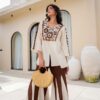 Vanilla Cocoa Embroidered Palazzo Co-ord Set for Women 2-Piece-front A woman styled in the Vanilla Cocoa Embroidered Palazzo Co-ord Set for office wear, paired with tan block heels and a leather tote bag.