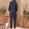 Back view of the women's charcoal blue co-ord set, highlighting the relaxed fit of the long shirt and tailored trousers.