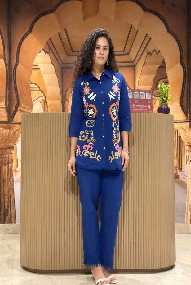 Woman wearing the navy blue Artisan embroidered 2-piece co-ord set, styled with elegant accessories for a complete everyday look.