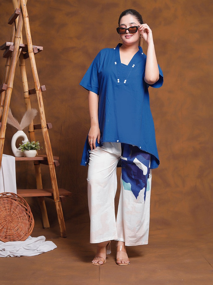 Woman wearing the complete royal blue tunic and printed pant co-ord set, fully styled with elegant accessories.