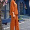 Profile view of a relaxed-fit ethnic fusion outfit in a rich earthy tone, highlighting the drape of the fabric.