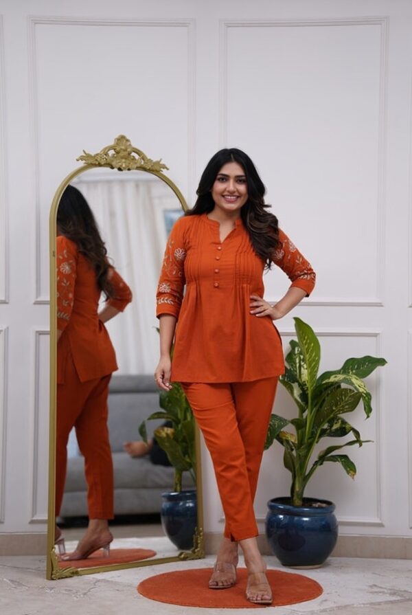 Rust Pin-Tuck Mandarin Collar Tunic Co-ord Set- Front view of a woman wearing Rust Tunic and matching straight-fit trousers from Fashion Bites.