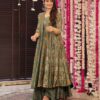 A model styled with oxidized silver jhumkas and flat sandals wearing the olive garden floral Anarkali set.