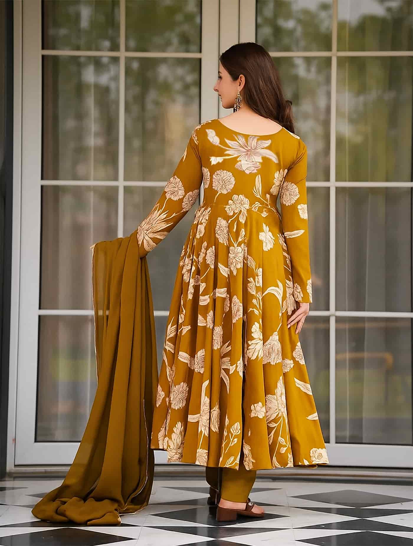 Rear view of a mustard yellow floral printed Anarkali showing a clean V-neck back and continuous print.