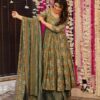 Side profile of a woman in an olive floral Anarkali highlighting the cinched waist and the fluid drape of the printed dupatta.