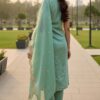 Rear view of a sleeveless mint green silk kurta showing a clean finish and high-quality fabric sheen.