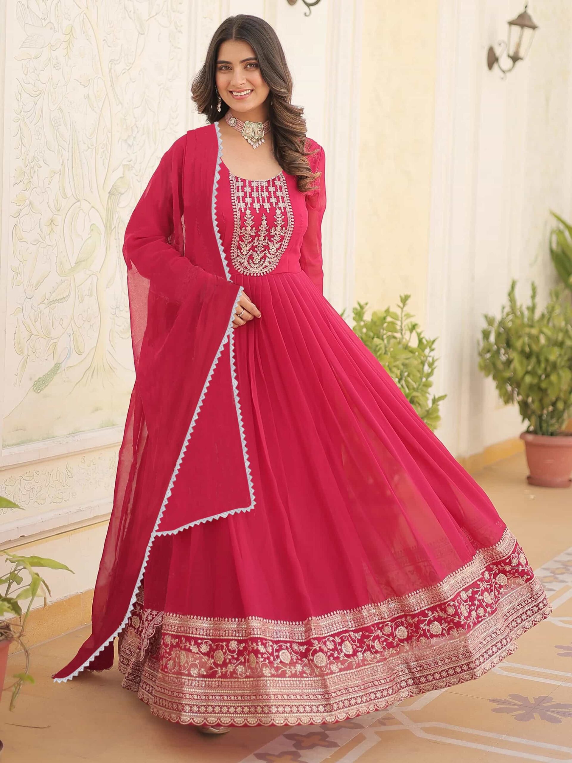 A model styled in the Scarlet Muse Anarkali with traditional silver jewelry for a festive look.