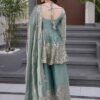 Rear view of a seafoam green silk kurta showing a structured fit and the smooth, premium metallic sheen of the silk.