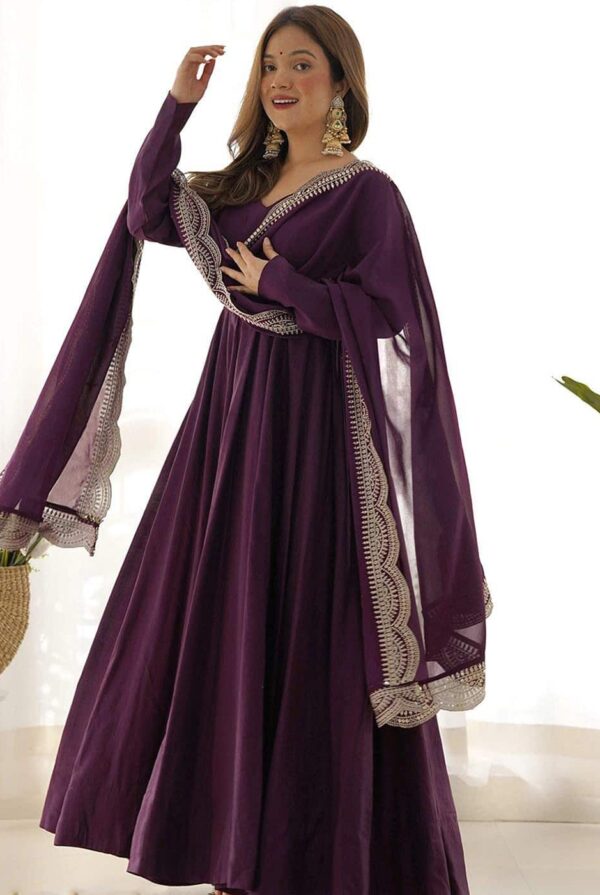 Front view of a floor-length deep wine purple Anarkali suit with long sleeves and a matching sheer dupatta.